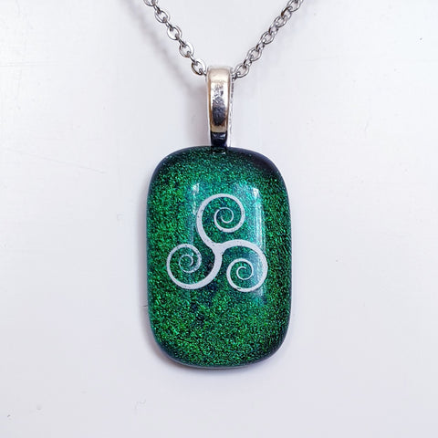 Triskele Enamel image dichroic glass pendant.
