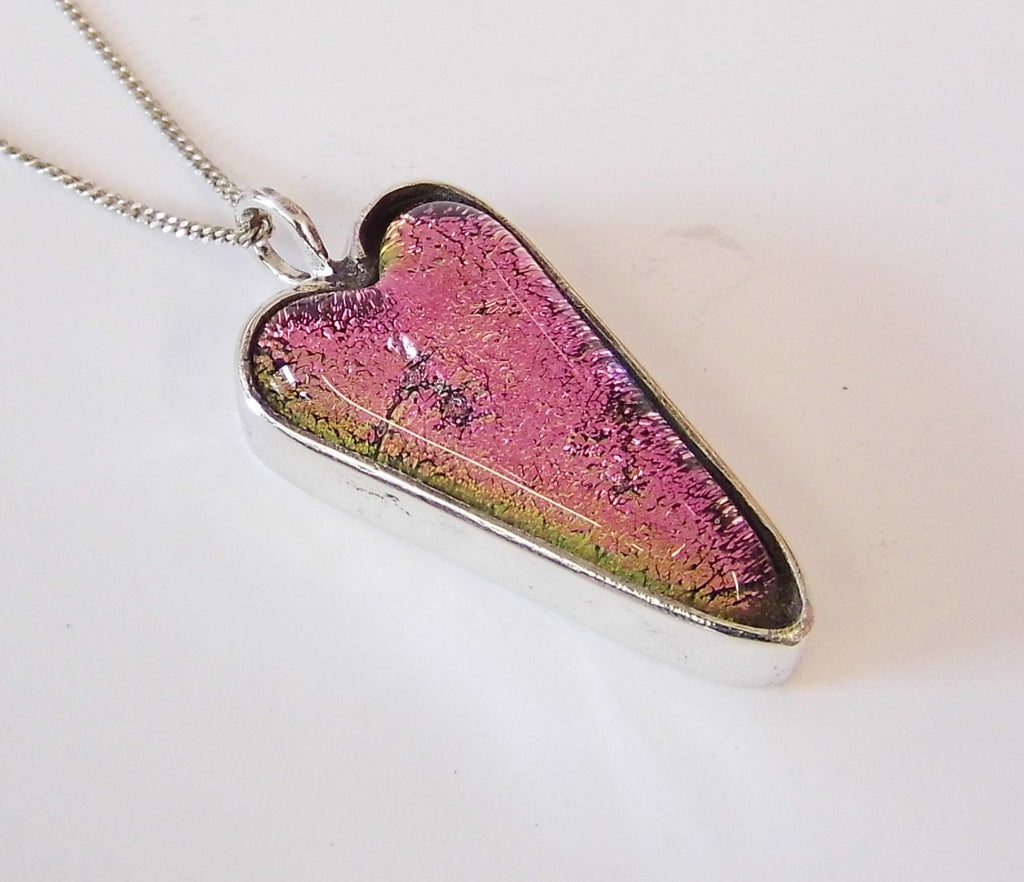 Sterling silver surround pendant with irrid glass heart.