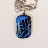 Etched dichroic pendant.