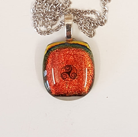 Triskele Enamel image dichroic glass pendant.